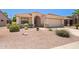 Inviting single-Gathering home featuring desert landscaping, arched entryway, and two-car garage at 17805 W Arizona Dr, Surprise, AZ 85374