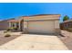 Inviting single-Gathering home featuring desert landscaping, arched entryway, and two-car garage at 17805 W Arizona Dr, Surprise, AZ 85374