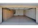 Spacious two-car garage with built-in storage cabinets and speckled epoxy flooring at 17805 W Arizona Dr, Surprise, AZ 85374