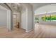 Hallway with wood-look floors that leads to the bathroom and living room at 17805 W Arizona Dr, Surprise, AZ 85374