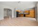 Open kitchen with wood cabinets and a view of the entryway at 17805 W Arizona Dr, Surprise, AZ 85374