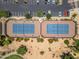 Overhead shot of well-maintained tennis courts with pristine surfacing at 17805 W Arizona Dr, Surprise, AZ 85374