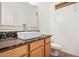 This bathroom features a vessel sink on a wooden cabinet, with a large mirror and decorative mosaic backsplash at 17862 N 114Th Ln, Surprise, AZ 85378