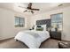This bedroom features a ceiling fan, neutral walls, and coordinated furniture that makes it feel relaxing and inviting at 17862 N 114Th Ln, Surprise, AZ 85378