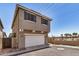 A view of the home exterior with garage and blue shutters at 17862 N 114Th Ln, Surprise, AZ 85378