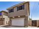 Home exterior with garage and blue shutters; located in a quiet neighborhood at 17862 N 114Th Ln, Surprise, AZ 85378