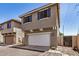 Home exterior with garage and blue shutters; located in a quiet neighborhood at 17862 N 114Th Ln, Surprise, AZ 85378