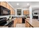 Functional kitchen featuring granite countertops, stainless steel appliances, and ample cabinet space at 17862 N 114Th Ln, Surprise, AZ 85378