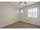 Bright bedroom featuring plush carpet, base molding, and natural light at 1886 E Don Carlos Ave # 136, Tempe, AZ 85281
