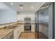 Kitchen features stainless steel appliances, white cabinets, and neutral countertops at 1886 E Don Carlos Ave # 136, Tempe, AZ 85281
