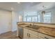 Kitchen features stainless steel dishwasher and sink, white cabinets and a neutral countertop at 1886 E Don Carlos Ave # 136, Tempe, AZ 85281