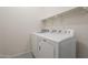 Laundry room featuring a white washer and dryer and shelf for storage at 1886 E Don Carlos Ave # 136, Tempe, AZ 85281