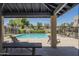 Community pool area features a large pool, ample seating, a ramada, and well-maintained landscaping at 1886 E Don Carlos Ave # 136, Tempe, AZ 85281