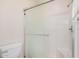 Clean bathroom with toilet, and shower with glass doors at 205 N 74Th St # 110, Mesa, AZ 85207