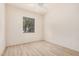 Inviting bedroom with wood-look flooring, neutral walls, and a window offering natural light at 205 N 74Th St # 110, Mesa, AZ 85207