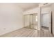Well-lit bedroom boasting wood-look flooring and a mirrored closet to enhance space and style at 205 N 74Th St # 110, Mesa, AZ 85207