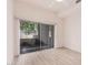 Bright bedroom includes wood-look floors, ceiling fan, and sliding glass door at 205 N 74Th St # 110, Mesa, AZ 85207