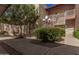 An apartment building exterior showing landscape, staircases, and walkways at 205 N 74Th St # 110, Mesa, AZ 85207