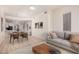 Bright living room featuring a modern sofa, stylish coffee table and a dining area with contemporary furniture at 205 N 74Th St # 110, Mesa, AZ 85207
