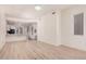 Spacious living area showcasing sleek wood-look floors and ample natural light at 205 N 74Th St # 110, Mesa, AZ 85207