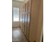 Walk-in pantry featuring light wood cabinets and bright natural light from the window at 205 N 74Th St # 110, Mesa, AZ 85207