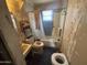 The bathroom features a shower/tub combo and vintage fixtures at 2415 E Wood St, Phoenix, AZ 85040