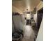 The kitchen is equipped with white appliances at 2415 E Wood St, Phoenix, AZ 85040