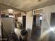 The kitchen is connected to an open-concept living space and is equipped with white appliances at 2415 E Wood St, Phoenix, AZ 85040