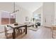 Bright living space featuring neutral colors, modern decor, and large windows for plenty of natural light at 2421 S 65Th Dr, Phoenix, AZ 85043
