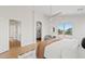 Bright main bedroom with a ceiling fan, ensuite bath, and lots of natural light at 2421 S 65Th Dr, Phoenix, AZ 85043