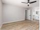 A light and airy bedroom with a ceiling fan, wood floors, and a walk-in closet at 3014 W Zachary Dr, Phoenix, AZ 85027