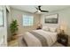 Cozy bedroom features a ceiling fan, large window, and stylish decor at 3014 W Zachary Dr, Phoenix, AZ 85027