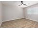 Bright, airy bedroom with hardwood floors, neutral paint, and large window at 3014 W Zachary Dr, Phoenix, AZ 85027