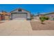 Inviting single Gathering home with a spacious driveway, desert landscaping, and a two-car garage at 3014 W Zachary Dr, Phoenix, AZ 85027