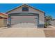 Spacious two-car garage with a clean, well-maintained door and exterior at 3014 W Zachary Dr, Phoenix, AZ 85027