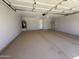 Spacious garage with a painted floor and ample storage space at 3014 W Zachary Dr, Phoenix, AZ 85027