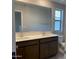 Bathroom featuring a double sink vanity, large mirror, neutral paint, and tiled floors at 31762 N Bandit Rd, San Tan Valley, AZ 85143