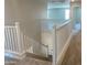 Carpeted staircase with white banister leading to the upper floor at 31762 N Bandit Rd, San Tan Valley, AZ 85143