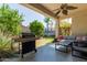 Relaxing covered patio with a grill, a ceiling fan, and a view of the backyard at 3553 W Dancer Ln, San Tan Valley, AZ 85144