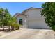 A beautiful single story home with desert landscaping and a large driveway with a two car garage at 3553 W Dancer Ln, San Tan Valley, AZ 85144