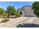 An attractive single-story home with a well maintained driveway and desert landscaping at 3553 W Dancer Ln, San Tan Valley, AZ 85144