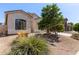 An attractive single story home with desert landscaping and an attached two car garage at 3553 W Dancer Ln, San Tan Valley, AZ 85144