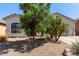 Charming home featuring low-maintenance landscaping and mature trees at 3553 W Dancer Ln, San Tan Valley, AZ 85144