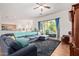 Bright and spacious living room with tile flooring, stylish furniture, and access to a patio at 3553 W Dancer Ln, San Tan Valley, AZ 85144