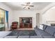 Cozy living room featuring tile floors, large sectional, and a stylish entertainment center at 3553 W Dancer Ln, San Tan Valley, AZ 85144