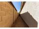 Narrow side yard with gravel, offering functional space at 3553 W Dancer Ln, San Tan Valley, AZ 85144