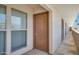 Exterior entrance of unit 202 with nearby windows on complex walkway at 3619 E Monterosa St # 202, Phoenix, AZ 85018