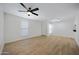 Large and well-lit living room featuring a ceiling fan and two windows at 3619 E Monterosa St # 202, Phoenix, AZ 85018
