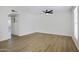 Spacious living room with light-colored wood floors and white walls at 3619 E Monterosa St # 202, Phoenix, AZ 85018