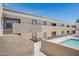 The community pool is enclosed by fencing at the base of a multi-story residential building at 3619 E Monterosa St # 202, Phoenix, AZ 85018